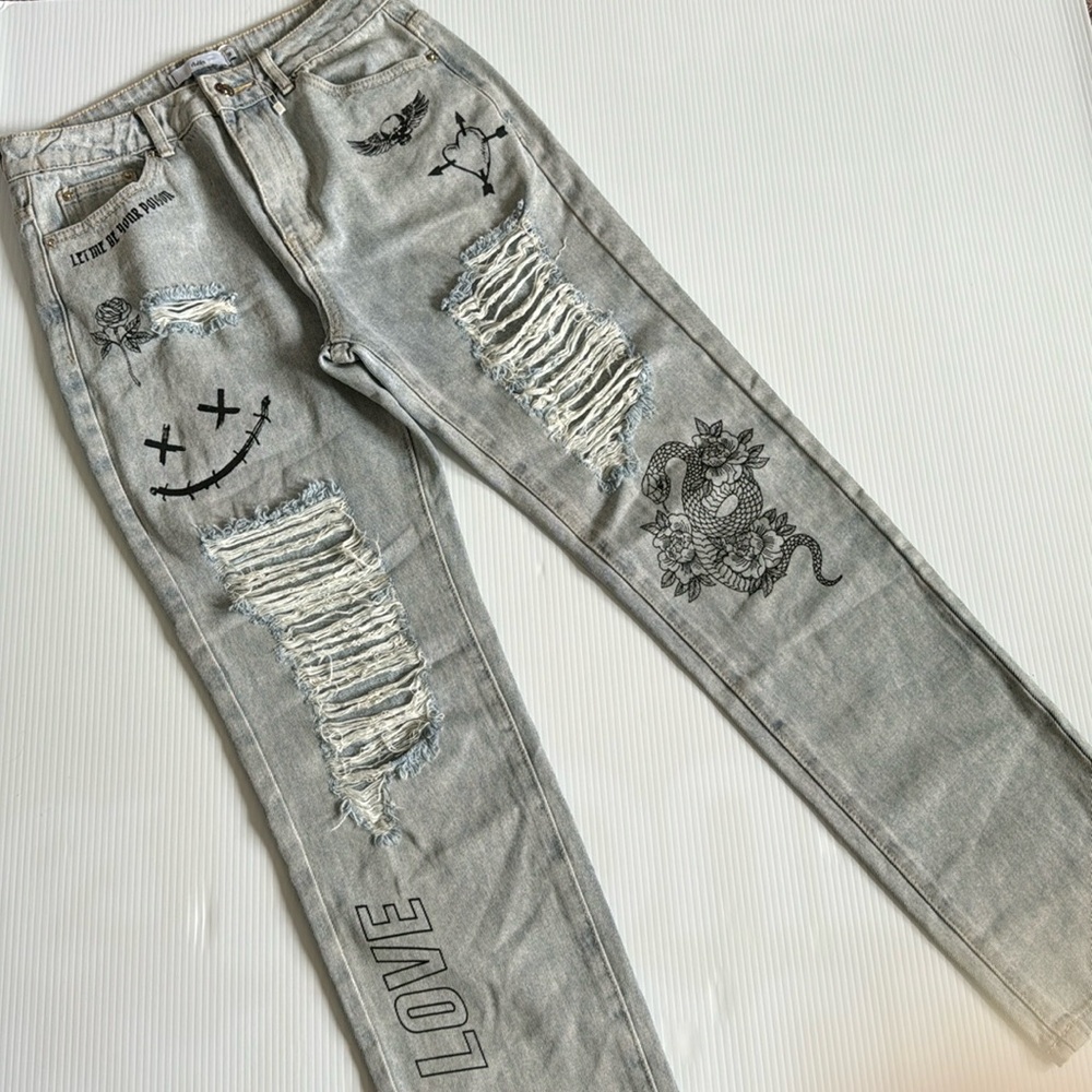 Adika distressed light wash 100% cotton jeans with skulls, hearts, roses. Medium